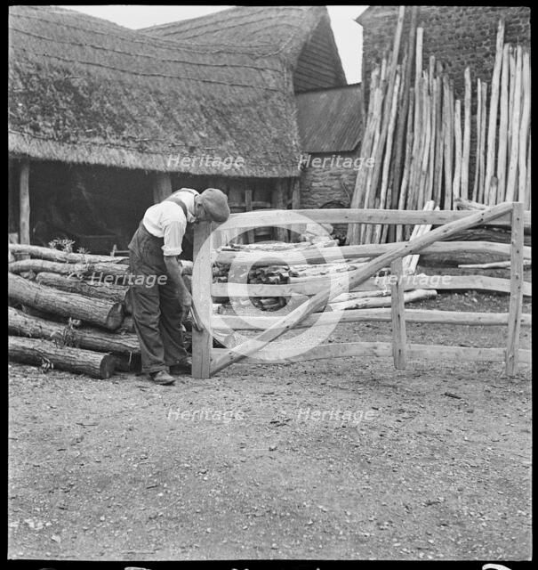 Man making a field gate in the village of Aston, Cote, Shifford and Chimney, Oxfordshire, 1930-50. Creator: George R Long.