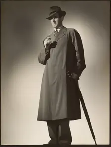 Man modeling trench coat, about 1943. Creator: Gunther Krampf