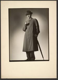 Man modeling trench coat, about 1943. Creator: Gunther Krampf