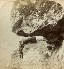Man on a cliff overlooking Naeroyfjord, Sogne, Norway. Creator: Bert Underwood