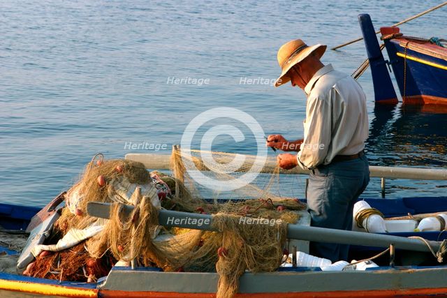 Man on board a fishing boat, Sami, Kefalonia, Greece. Creator: Peter Thompson.