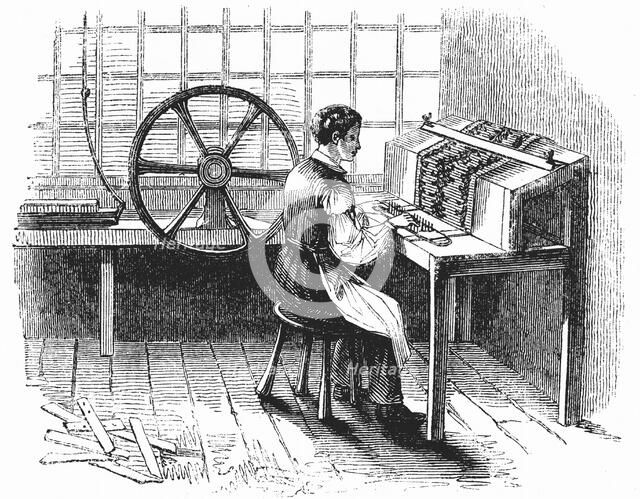 Man operating machine punching cards for Jacquard looms, 1844. Artist: Unknown