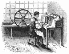 Man operating machine punching cards for Jacquard looms, 1844