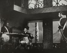 Man at table with bottle, 1938. Creator: Unknown