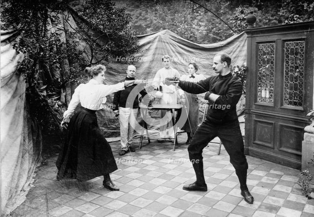 Man and woman fencing (?), between c1910 and c1915. Creator: Bain News Service.