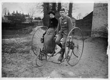 Man and a woman sitting on a double tricycle, England, c1890. Creator: Unknown