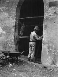 Man and horse in stall, New Orleans or Charleston, South Carolina, between 1920 and 1926. Creator: Arnold Genthe