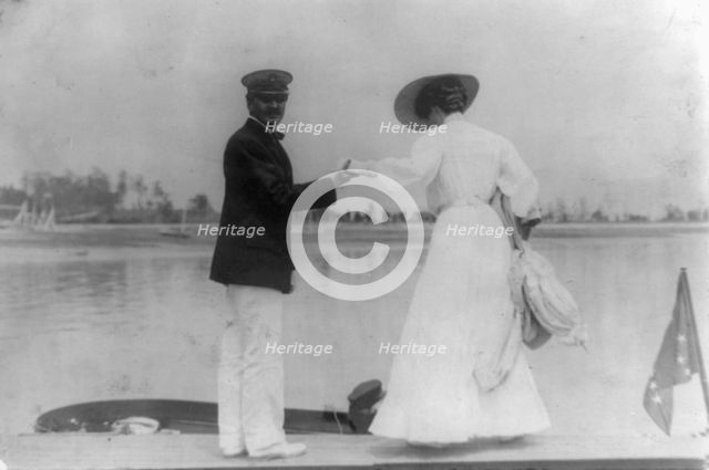 Man assisting woman into boat, Oyster Bay, Long Island, N.Y., 1905. Creator: Frances Benjamin Johnston.