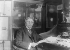 Man (banker?) seated at desk at American Security and Trust Co., Washington, D.C., c1890 - c1950. Creator: Frances Benjamin Johnston