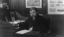 Man (banker?) seated at desk in American Security and Trust Co., Washington, D.C., c1890 - c1950. Creator: Frances Benjamin Johnston