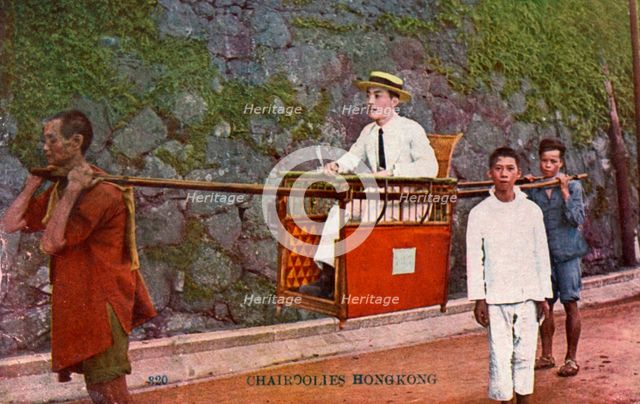 Man being carried on a Sedan chair, Hong kong, 20th century. Artist: Unknown
