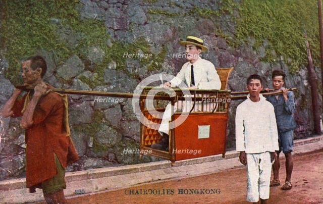 Man being carried on a Sedan chair, Hong kong, 20th century. Artist: Unknown