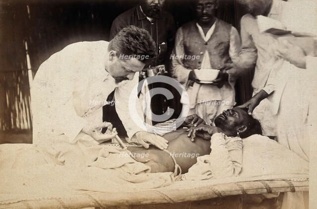Man being injected by doctor, during the outbreak of bubonic plague in Karachi, India, 1897. Creator: Unknown.