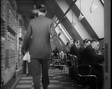 Man Entering Office at BBC Broadcasting House, 1936. Creator: British Pathe Ltd