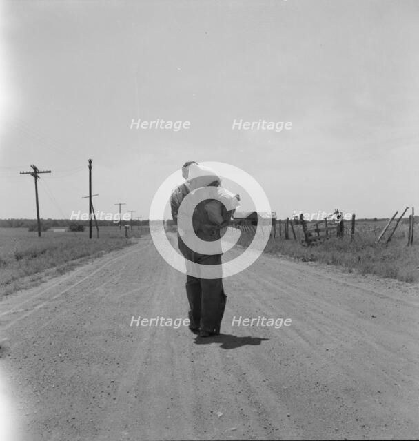 Man going home with relief, near Oil City, Carter County, Oklahoma, 1937. Creator: Dorothea Lange.