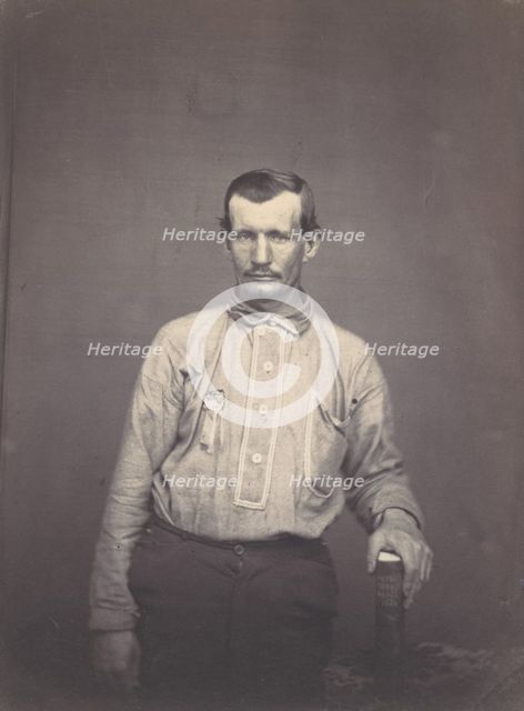 Man Holding Patent Office Book, ca. 1857. Creator: Attributed to Oliver H. Willard.