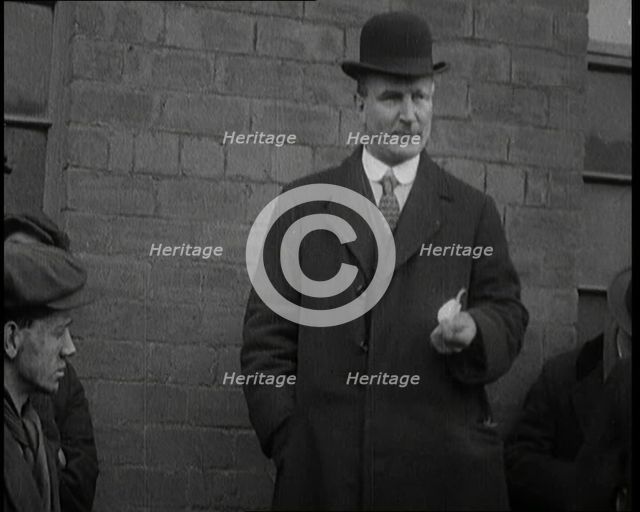 Man in a Bowler Hat Speaking to Crowds, 1920. Creator: British Pathe Ltd.
