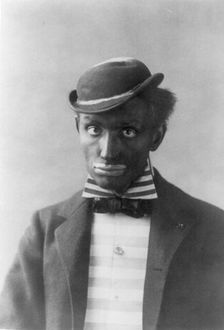 Man in blackface as minstrel, between c1890 and c1910. Creator: Frances Benjamin Johnston