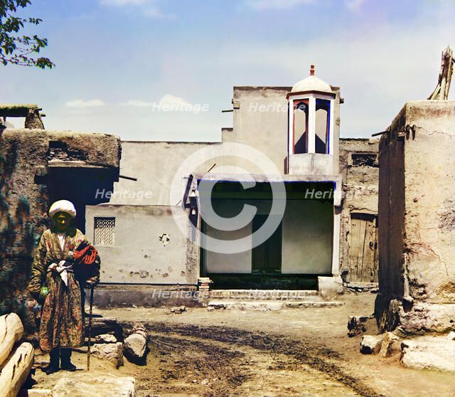 Man in courtyard, between 1905 and 1915. Creator: Sergey Mikhaylovich Prokudin-Gorsky.