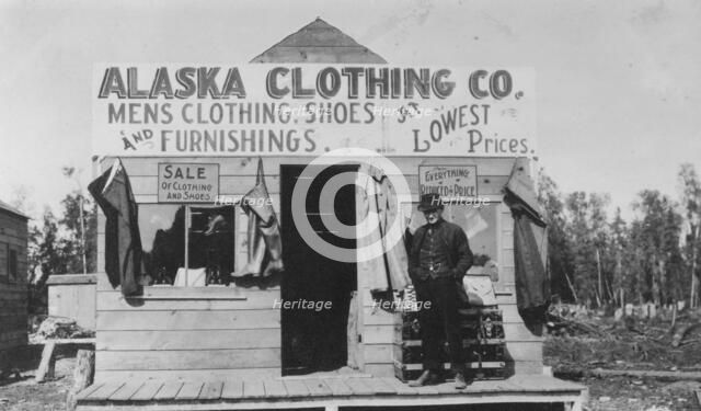 Man in front of Alaska Clothing Co. store, between c1900 and 1916. Creator: Unknown.