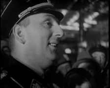 Man in Uniform Surrounded by a Crowd, 1930s. Creator: British Pathe Ltd