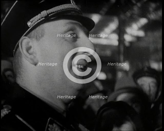 Man in Uniform Surrounded by a Crowd, 1930s. Creator: British Pathe Ltd.