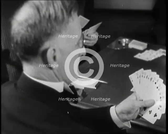 Man Playing Contract Bridge, 1930s. Creator: British Pathe Ltd.