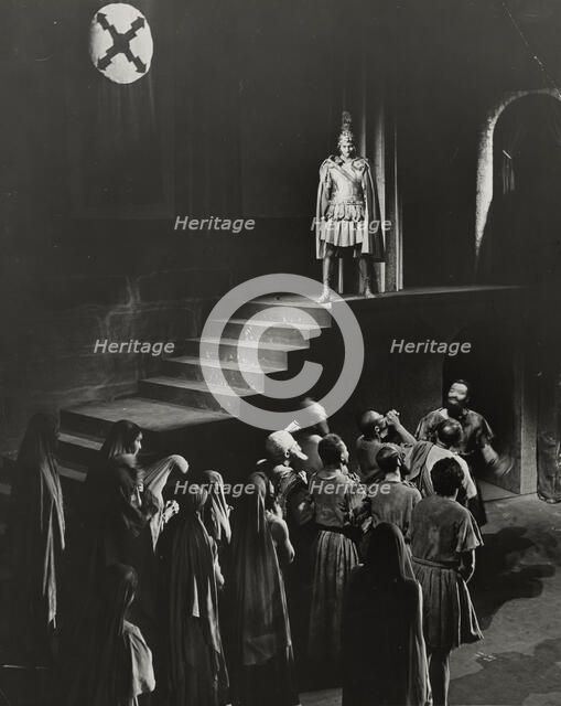 Man standing above crowd, 1938. Creator: Unknown.