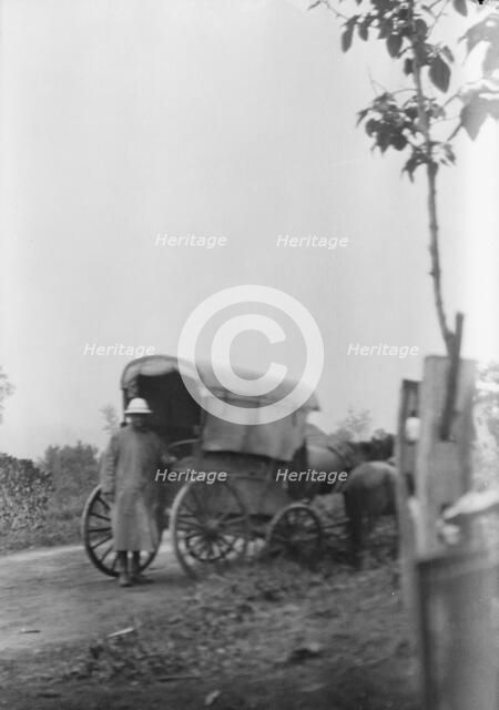 Man standing behind a horse-drawn wagon, Japan, 1908. Creator: Arnold Genthe.