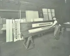 Man stencilling signs for tram cars at Charlton Central Repair Depot, London, 1932