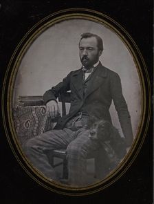 Man Seated at Table with Dog, 1840s. Creator: Unknown