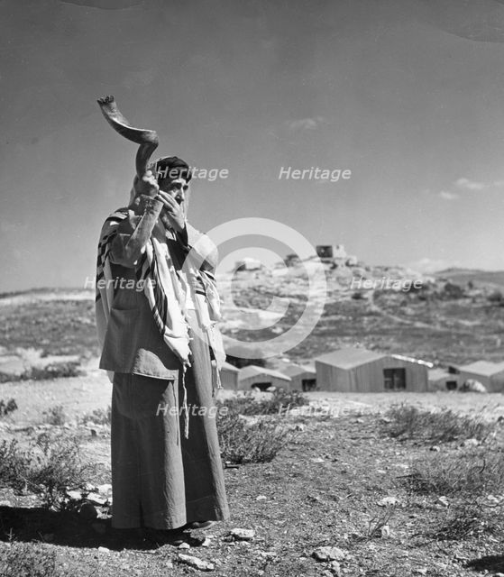 Man sounding a shofar, 1998. Creator: Unknown.