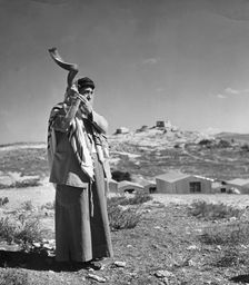 Man sounding a shofar, 1998. Creator: Unknown