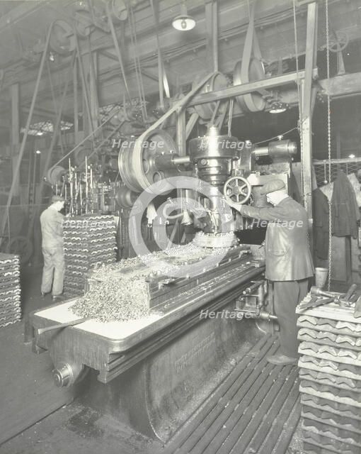 Man using a miller and planer, Charlton Central Repair Depot, London, 1932. Artist: Unknown.