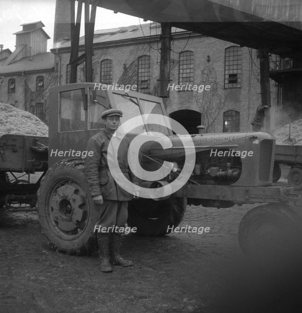 Man with a tractor at the sugar mill in Arlöv, Scania, Sweden, c1940s(?). Creator: Otto Ohm.