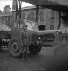 Man with a tractor at the sugar mill in Arlöv, Scania, Sweden, c1940s(?). Creator: Otto Ohm