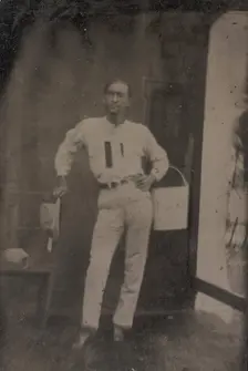 Man with a Bucket on his Arm, 1880s-90s. Creator: Unknown