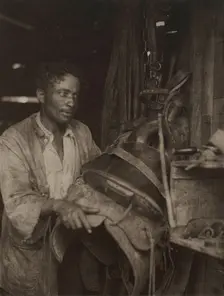 Man With A Saddle, c1920s. Creator: Doris Ulmann