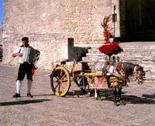 Man with accordion and decorated pony and cart, Erice, Sicily. Creator: Peter Thompson