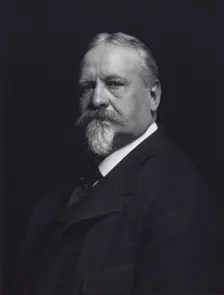 Man with mustache and goatee, facing left, half-length portrait, c1900. Creator: F. Gercher