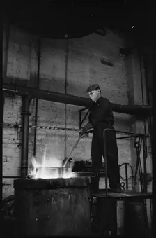 Man working at the Wear Flint Glass Works, Alfred Street, Millfield, Sunderland, 1961. Creator: Eileen Deste
