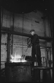 Man working at the Wear Flint Glass Works, Alfred Street, Millfield, Sunderland, 1961. Creator: Eileen Deste