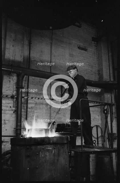 Man working at the Wear Flint Glass Works, Alfred Street, Millfield, Sunderland, 1961. Creator: Eileen Deste.