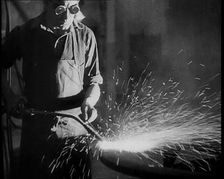 Man Working in a Factory, 1933. Creator: British Pathe Ltd