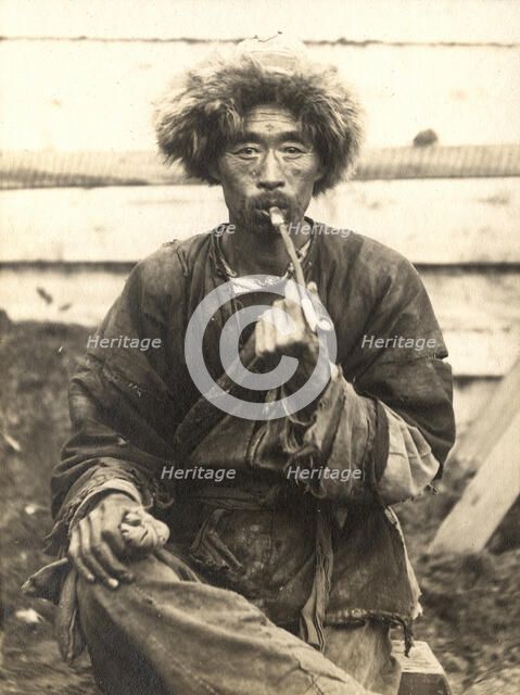 Manchu smoking a pipe, 1909. Creator: Vladimir Ivanovich Fedorov.