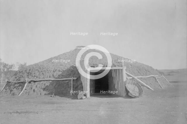 Mandan earthen lodge, c1908. Creator: Edward Sheriff Curtis.