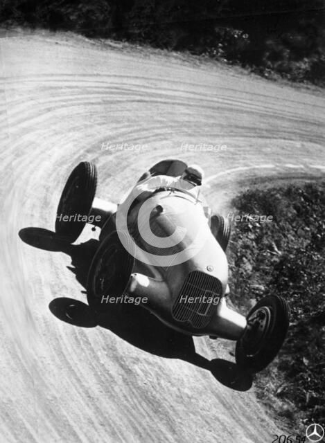 Manfred von Brauchitsch driving Mercedes-Benz W25 Grand Prix car, 1934. Artist: Unknown