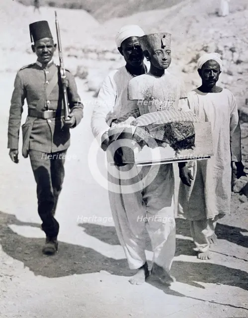 Mannequin or bust of Tutankhamun being carried from his tomb, Valley of the Kings, Egypt, 1922. Creator: Harry Burton.