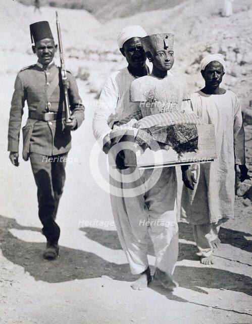 Mannequin or bust of Tutankhamun being carried from his tomb, Valley of the Kings, Egypt, 1922. Artist: Harry Burton