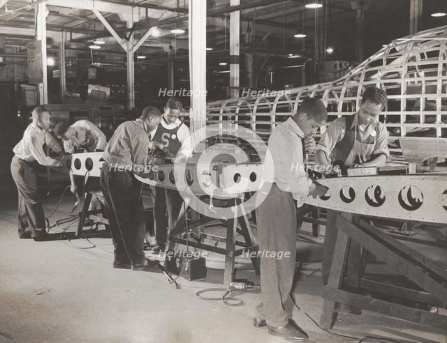 Manpower: Negro bomber plant workers, 1942-05. Creator: Howard Liberman.
